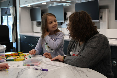 In Pittsburgh, this student was learning to make a bracelet spelling their name in binary code during Computer Science Week.