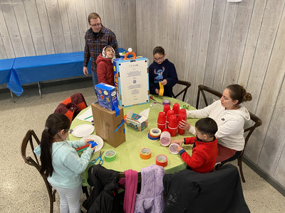Reach families worked alongside students for our Trash to Treasure themed Winter STEM Challenge.